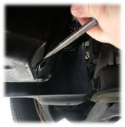Removing the drain plug gasket.