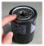 Lubricate the gasket on the new filter with new oil.